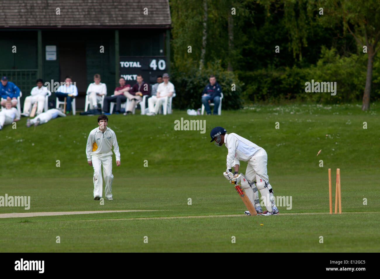 University sport, men`s cricket at Warwick University, England, UK. Batsman bowled out, bails flying. Stock Photo